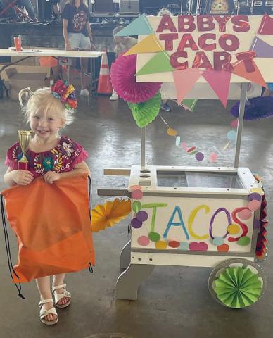 “Abby’s Taco Court” – Abby Smrkovsky.  Sticker Photo By Darrell Vyvjala