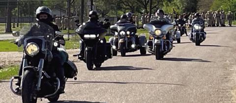 American Legion Riders from Benbrook Post 297, Schulenburg Post 143 and Sealy Post 442 lead cadets from Texas ChalleNGe Academy in Eagle Lake in a parade march to their families on family day at Nada Community Center.