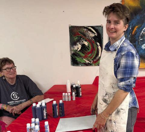 In her painting without brushes class on Artful Friday, Jaime Janda (right) had her group of students breaking out of their comfort zone. Berni Gillings (left) was primed and ready to do something new – she thoroughly enjoys the program.
