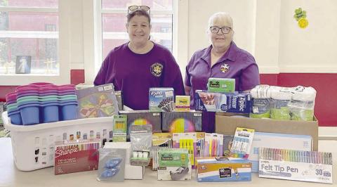 CDA Court St. Rose 1597 regent Grace Lebeda (left) and recording secretary Phyllis Valchar (right) with the school supplies donated to St. Rose of Lima Catholic School.