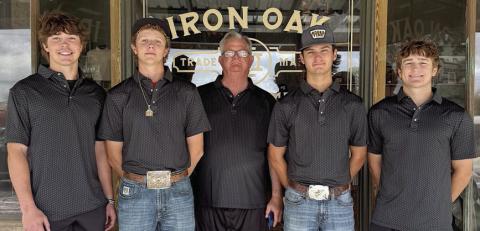 Showing off the apparel donated by Iron Oak are Shorthorn golfers (from left) Jayse Janda and Tayt Wenske, (from right) Reid Janda and Brant Redman, along with coach Richard Hoogendoorn (center). Team members not pictured: Van and Koi Prihoda.