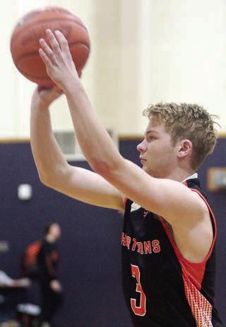Caden Herzik lines up a three-pointer in the first quarter against Weimar. Sticker Photo By Darrell Vyvjala
