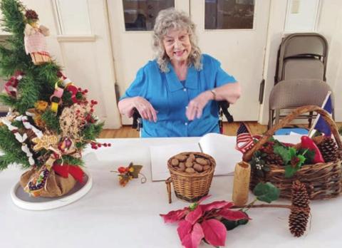 MEDA WOGAN spoke to the Garden Club on including native Texas plants in Christmas decorations.