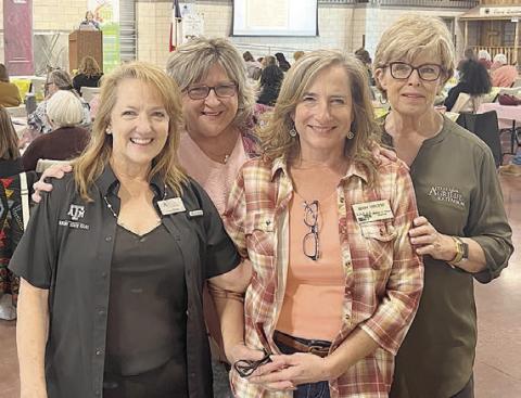 Family and community health Extension agents hosting Multi-County/District Early Childhood Conference were (from left) Gayle Bludau, Gonzales County agent; Denise Goebel, DeWitt County agent; Cindy Vincent, Lavaca County host volunteer; and Sally Garrett, Fayette County agent.