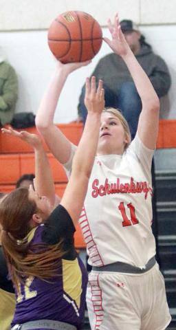 d Alana Herzik scores  on the baseline in the second quarter of the Lady Horns’ win over Shiner. Sticker Photo By Darrell Vyvjala