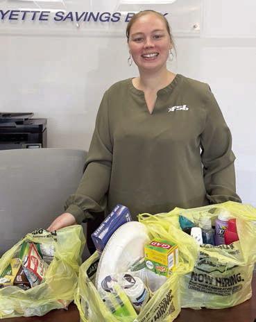 Dona ting bingo prizes to Senior Connections was Brandi Rerich of Fayette Savings Bank.