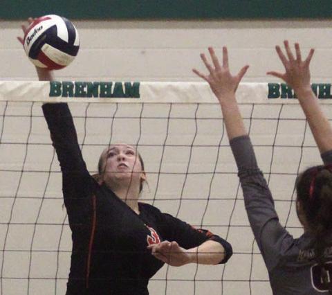 Reagan Dusek goes for a kill in game three.