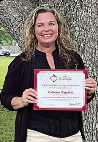 SHS Principal Callene Zapalac displays the certificate of recognition she received as a semifinalist for the H-E-B Education in Excellence Award.