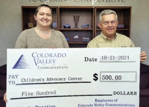 Colorado Valley Telephone Cooperative members donated funds to the Children’s Advocacy Center as the result of funds collected during Document Shred Day. Shown are (from left) Children’s Advocacy Center CEO Megan Webb and Colorado Valley Communications General Manager KellyAllison.