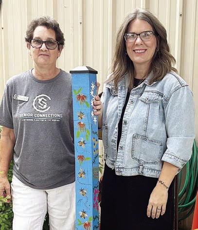 garden pole delivery continues. Jill Walles (right) receives this beautiful pole painted by Berni Gillings from Stephanie Shroyer (left), program director. Walles is the executive director of the Flatonia Chamber of Commerce, and Senior Connections appreciates the support through weekly e-news blasts for its programs in this active community.