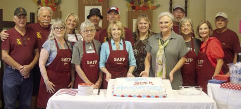 Schulenburg Area Food Pantry board members and volunteers on hand at last week’s 30th anniversary open house were: (front from left) Jana Semler, Delores Michalke, Veronica Smith, Debra Blansitt, Debbie Behlen, Judy Janik; (back, from left) Bill Michalke, Dallas Canada, Sue Broadwater, Ed Semler, Gerald Smith, Sheila Brossmann, Kenneth Behlen, and Jack Niesner. Sticker Photo By Darrell Vyvjala