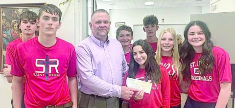 Knights of Columbus Council 2902 held a fish fry on Ash Wednesday, Feb. 18 and donated the proceeds to St. Rose of Lima Catholic School. Shown at the check presentation are (front row, from left) Kaleb Zapalac; Paul Zapalac, grand knight, representing Council 2902; Elli Wotipka, Brynn Bubela, Charlotte Schmidt, (back row) Bryson Ohnheiser, Patrick Taylor and Austin Reeves.