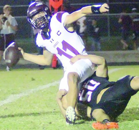 Preston Kahn spins Bryce Ullman around inside the 5-yard line, resulting in a lateral that rolled through the end zone for a safety in the second quarter. Sticker Photo By Layne Vyvjala