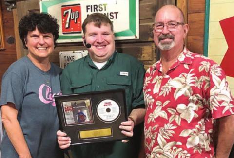 Novak receives plaque