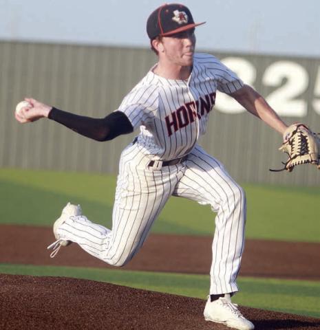 Nick Goode delivers a pitch in game one. Sticker Photo By Darrell Vyvjala