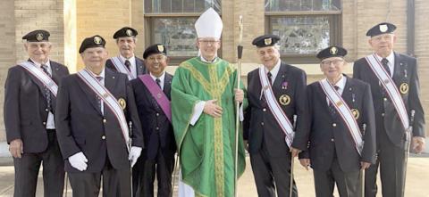 The Knights of Columbus, St. Michael 4th Degree Assemblies, served as honor guard for Most Rev. Brendan Cahill, Bishop of the Victoria Diocese, during the installation of Fr. Chase Goodman as pastor of St. Michael the Archangel Catholic Church in Weimar on Saturday, July 29. Shown are (from left) Leonard Korenek-Schulenburg, Frank Janacek-Weimar, Delphin Bartek-Weimar, Joe Jimenez-Weimar, Bishop Brendan Cahill, Dennis Olsovsky-Flatonia, Charlie Herzik-Weimar and Ken Berger-Schulenburg.