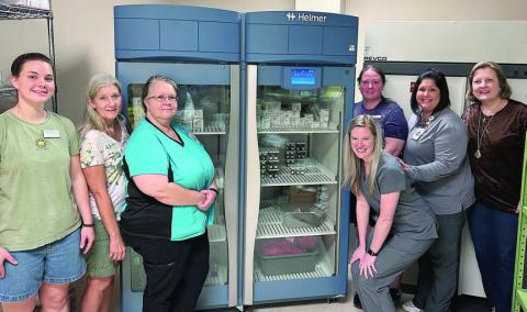 A high-tech laborator y refrigerator was purchased by St. Mark’s Medical Center with funds provided by Second Chance Emporium. Shown with the new piece of equipment are (front row, from left) Julia Thomas, SCE assistant store director; Gayle Schielack, SCE store director; Stacey Weyenberg, MLT, St. Mark’s; Valerie Otto, MT, St. Mark’s; (back row) Stacy Cada, SCE assistant store director; Amanda Fuchs, MT, director, St. Mark’s Laboratory Services; and Linda Morrison, SCE board secretary.