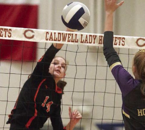 Emmrie Marx sends a kill cross-court in the second set. Sticker Photo By Darrell Vyvjala
