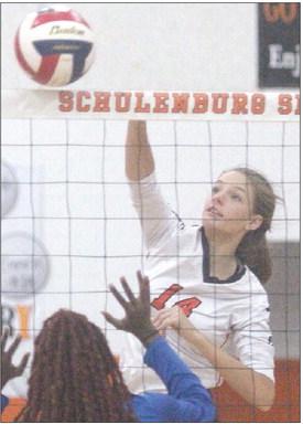 Emmrie Marx collects one of her 17 kills against Waelder. Sticker Photos By Darrell Vyvjala