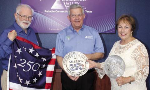 To celebrate America’s 250th birthday, 250 “Liberty Trees” will be planted this fall all across the county. Colorado Valley Communications is the first Gold Sponsor for the project. Larry Jackson (left), project chair, and Karen Mahoney-Woods (right), project secretary, present CVCTX President/General Manager Kelly Allison with a Liberty Tree commemorative medallion.