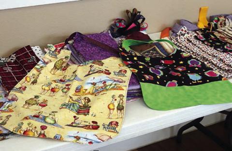A total of 153 more adult shirt protectors were brought by members to the Colorado Valley Quilt Guild meeting.
