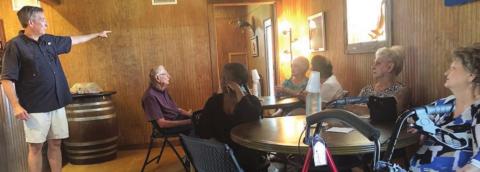 Whistling Duck Winery near Weimar was the destination of a NVCC day trip on Thursday, May 12. John Cook (left), owner, gave the history of the winery and also talked about the grape vines and their care.
