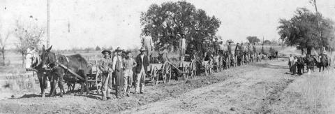 “The Cedar Farmers Good Road Club built over 5,000 yards of Good Road in 11 days in Feb. 1921 near La Grange, Tex. Gravel from 14 to 16 inches thick.”– Photograph by Louis Melcher/Courtesy of Fayette Heritage Museum &amp; Archives
