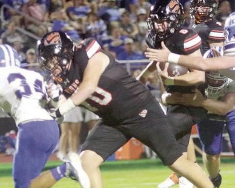 Hayes Baumgarten leads the way for Owen Brenek on a first-quarter run. Sticker Photo By Layne Vyvjala