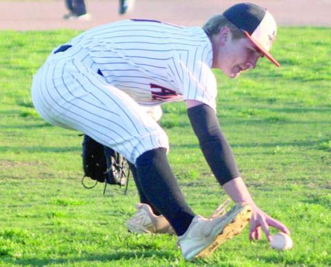 Brycen Schramek comes off the mound to grab a Ganado bunt for an out early in last week’s game. Sticker Photo By Darrell Vyvjala