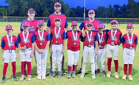 Members of the Twin Cities (Schulenburg and Flatonia) Minor League (9- and 10-year-old) all-star team: (front, from left) Barett Redman, Jaxon Kurtz, Jayce Hajdik, Jett Bailey, Noah Heger, Jack Schiffli, Paycen Beck, Reece Blansitt, Luke Goedrich; (back, from left) manager Neal Goedrich, coach Ben Bailey, and coach Tad Beck. Sticker Photo By Darrell Vyvjala