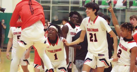 Bryce Wilson (left) jumps for joy as he celebrates Friday’s Class 2A Region IV final win over Port Aransas with teammates Kenny King (No. 1), Alex Lozano (No. 21), and Keisean Johnson (No. 2). Sticker Photo By Layne Vyvjala