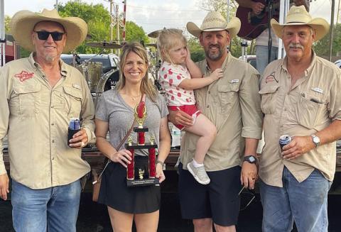 “BEER 30 COOKERS” – 2ND PLACE SAUSAGE-BASED CONCOCTIONS / SHOWMANSHIP – (from left) Arthur Mendoza, Emily and Jon Matus (holding daughter, Natalie), and Allen Matus.