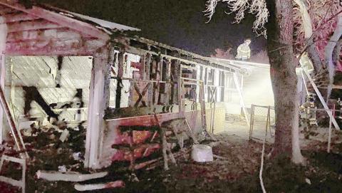 Firefighters continue to work in the early morning hours of Jan. 21 after a fire gutted the garage at the intersection of Bohlmann Avenue and Baumgarten Street. Photo Courtesy of SVFD