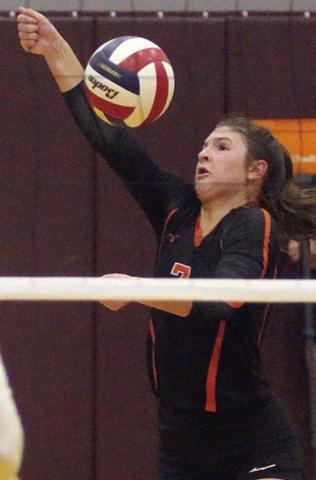 Landry Zapalac reaches to save a ball in the fourth set in Flatonia. Sticker Photo By Darrell Vyvjala