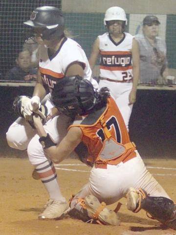 Catcher Kassidy Kubala tags out a Lady Bobcat trying to score in the top of the sixth inning of game 3. She took the throw from centerfielder Rilee Sanchez and was able to hang on to the ball after the collision in front of home plate. Sticker Photo By Darrell Vyvjala