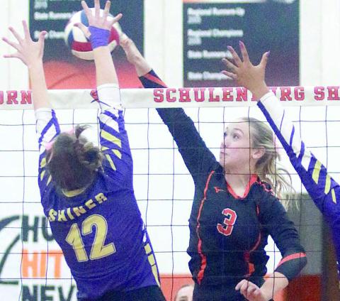 Reagan Dusek directs an attack past a Lady Comanche block attempts for a point in the first set. Sticker Photo By Darrell Vyvjala