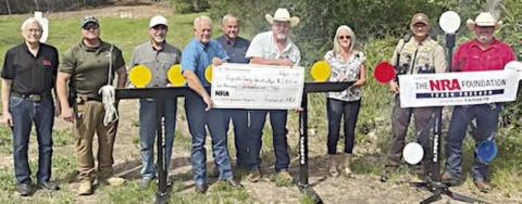On hand as a $2,801 grant was presented by The NRA Foundation and Friends of NRA to the Fayette County Sheriff's Office were (from left) Charlie Murray; Investigator Kenn Kretz of the FCSO; John Salem, Dennis Brower and Craig Schulz; Sheriff Keith Korenek; Lazy Q Ranch &amp; Training Facility manager Lori Gray; and Sgt. Ron Naumann and Lt. David Beyer of the FCSO.