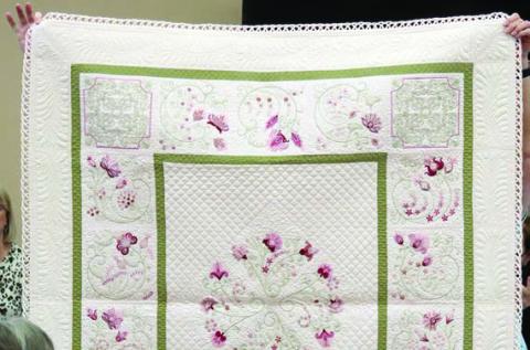 Quilting and looped binding technique example given.