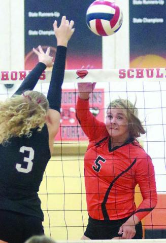 Haylee Vacek registers a kill against Fayetteville. Sticker Photo By Darrell Vyvjala