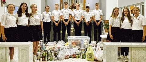 St. Rose collects for Family Crisis Center, SaFP at Thanksgiving Mass