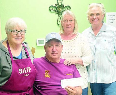 Linda Besetzny (second from right), representing the Assumption of the Blessed Virgin Mary KJZT Lodge No. 65 of Holman and the feeding families campaign, donated $200 to the Schulenburg Area Food Pantry. Accepting donation are (from left) Coleen McGill and Rodney Michalke, both pantry volunteers, and (right) Debra Blansitt, SAFP president.