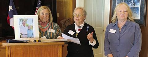 Kathy Aydellote was unable to be present to receive the Community Service Award from the Smith McMillan Chapter NSDAR. Shown accepting on her behalf are (from left) Kathryn Callaway, holding a portrait of Kathy Aydelotte and husband Eldon; Sally Reynolds, Community Service Awards chair; and Janet Murphy.