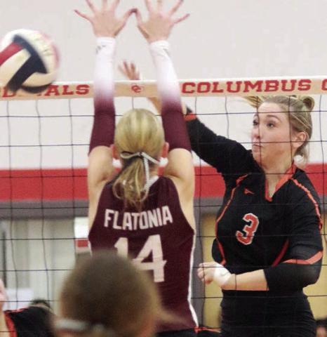 Reagan Dusek directs an attack cross-court for a point in the fourth set. Sticker Photo By Darrell Vyvjala