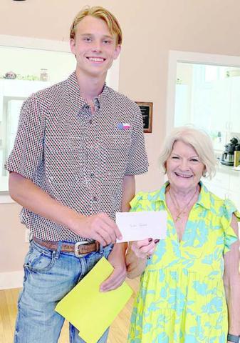 Scholarship – Duke Sodek, Fayette County Czech Heritage Society scholarship recipient, receives a $500 check from CHS president Betty Danner.