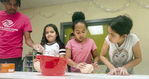 During the S.T.E.M program last week at the Schulenburg Unit of the Boys &amp; Girls Club, members learned about volcanos and were able to make one from scratch. After the kids squeezed a vinegar mixture into the top of the volcano, they were very excited to watch it erupt with lava! Shown are (from left) Deonte Houston-staff member, Jocelyn Alejandres, Layla Thomas and Jacquelyn Alejandres.