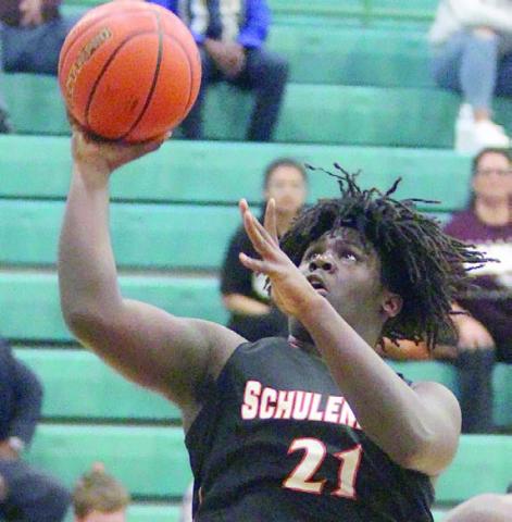 Tavondrick Ellison goes up for a basket in the fourth quarter. Sticker Photo By Darrell Vyvjala