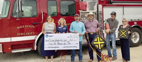 A new brush truck and resc ue equipment will be purchased by the Muldoon Volunteer Fire Department with the assistance of a $25,000 grant awarded through the LCRA Community Grants program. Shown are (from left) Melissa K. Blanding and Margaret D. “Meg” Voelter, LCRA board members; Stephen Kelly, Muldoon VFD president and fire chief; Craig Moreau, public information officer and firefighter; Herbert Hart, firefighter; and Kate Ramzinski, LCRA regional affairs representative.
