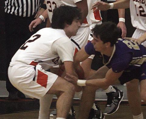 Graylen Adams ties up a Comanche in the second quarter. Sticker Photo By Darrell Vyvjala