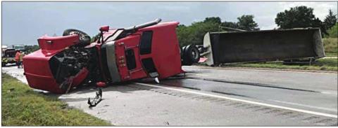 At left: The separated tractor-trailer blocks I-10 eastbound after overturning last Tuesday, July 28. Photos Courtesy of Schulenburg VFD