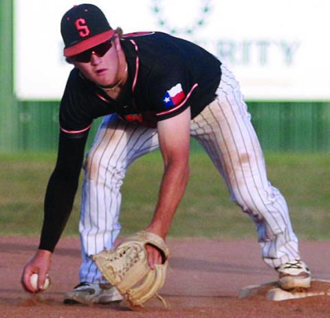Shortstop Reid Janda picks up a ground ball after it was deflected by pitcher Connor Lichnovsky to turn a double play in the third inning against Weimar. Sticker Photo By Darrell Vyvjala